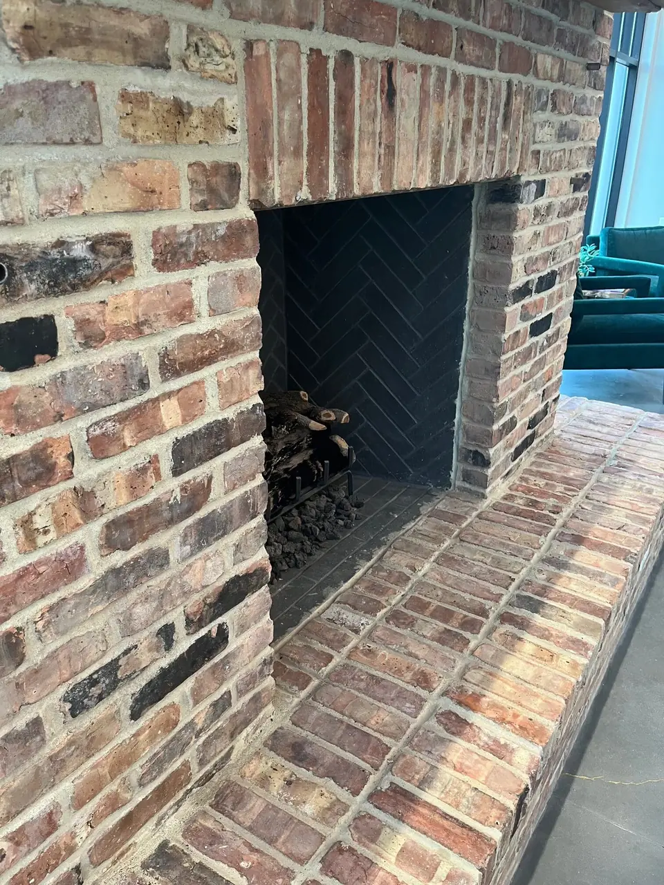 Fireplace and raised hearth built from reclaimed Chicago brick