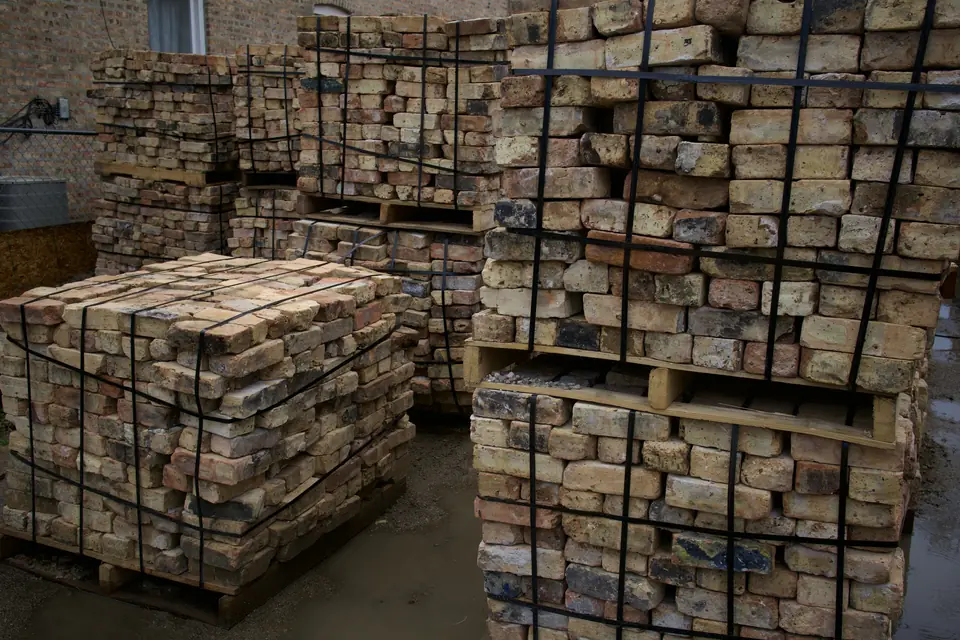 Banded pallets of mixed reclaimed Chicago brick ready for pickup